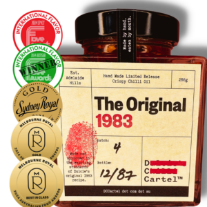 The Original 1983 Limited Release Crispy Chilli Oil in glass jar with visible gold medals and awards on the left side of the label