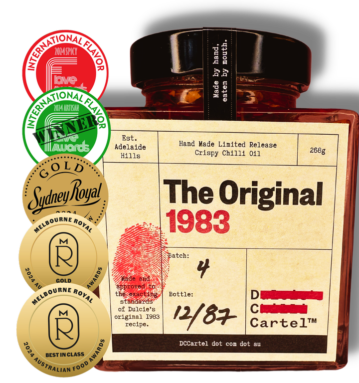 The Original 1983 Limited Release Crispy Chilli Oil in glass jar with visible gold medals and awards on the left side of the label